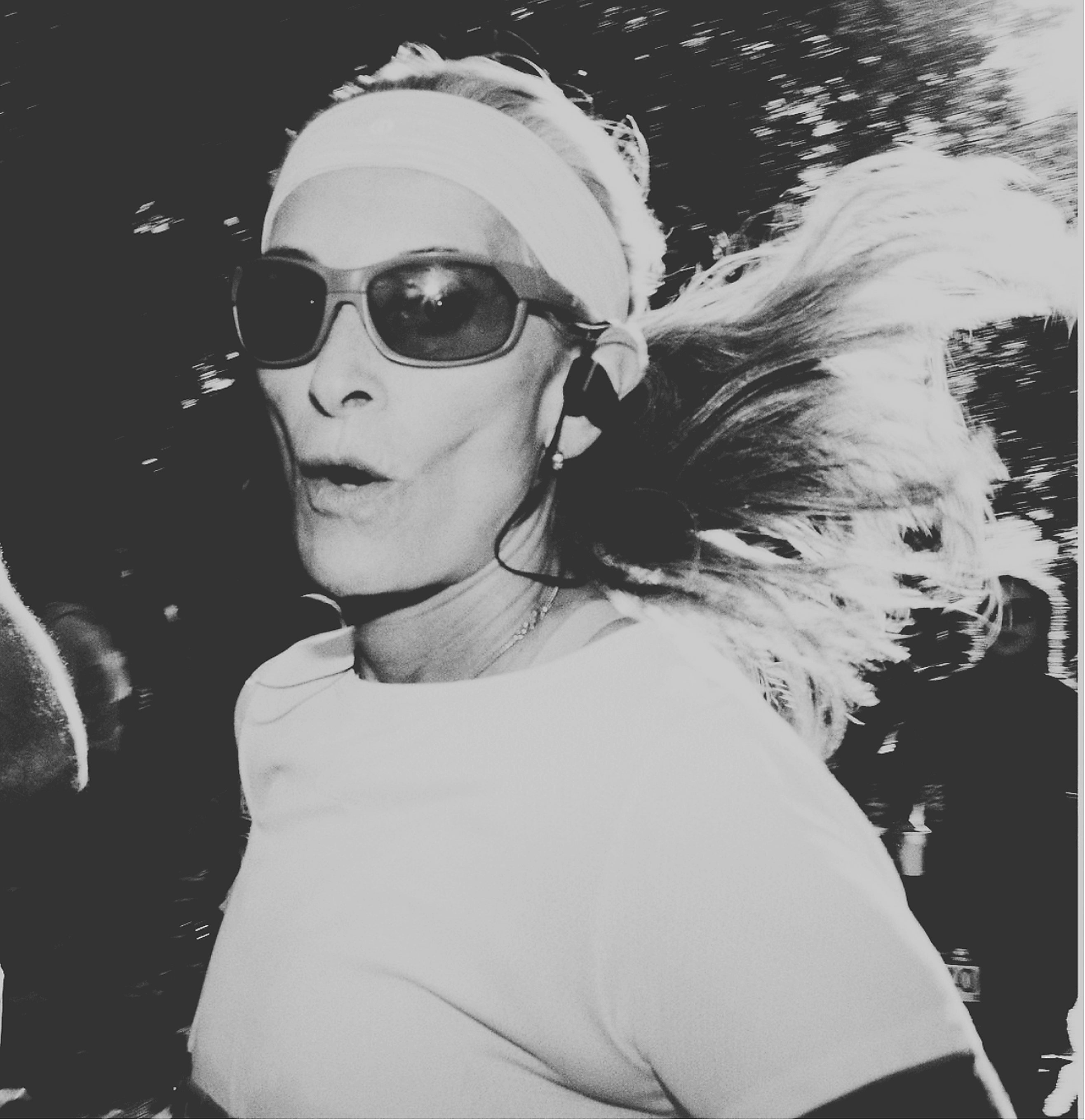 Runner wearing sunglasses and a headband